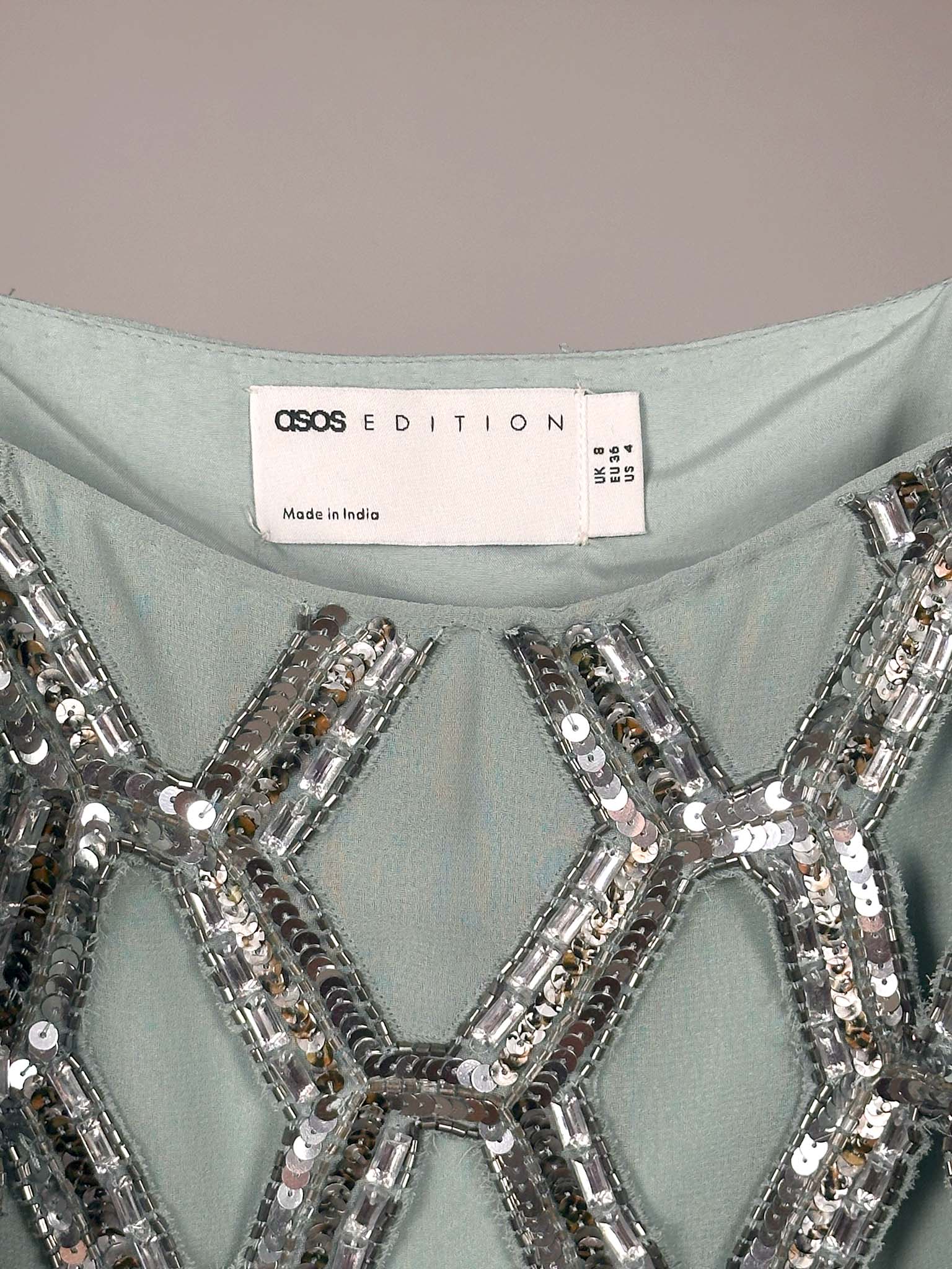 Light blue dress with silver sequin detailing and ASOS Edition label.