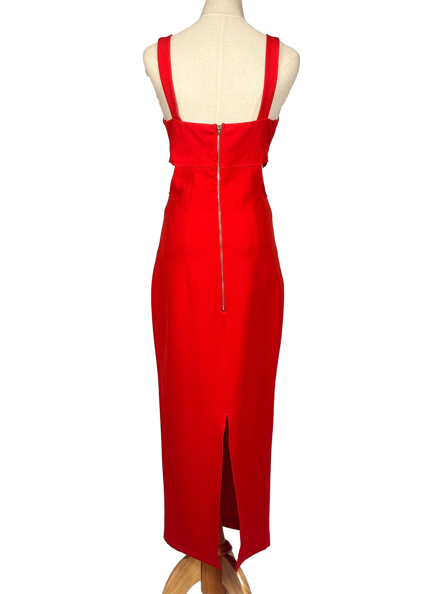 Red dress on a mannequin against a white background