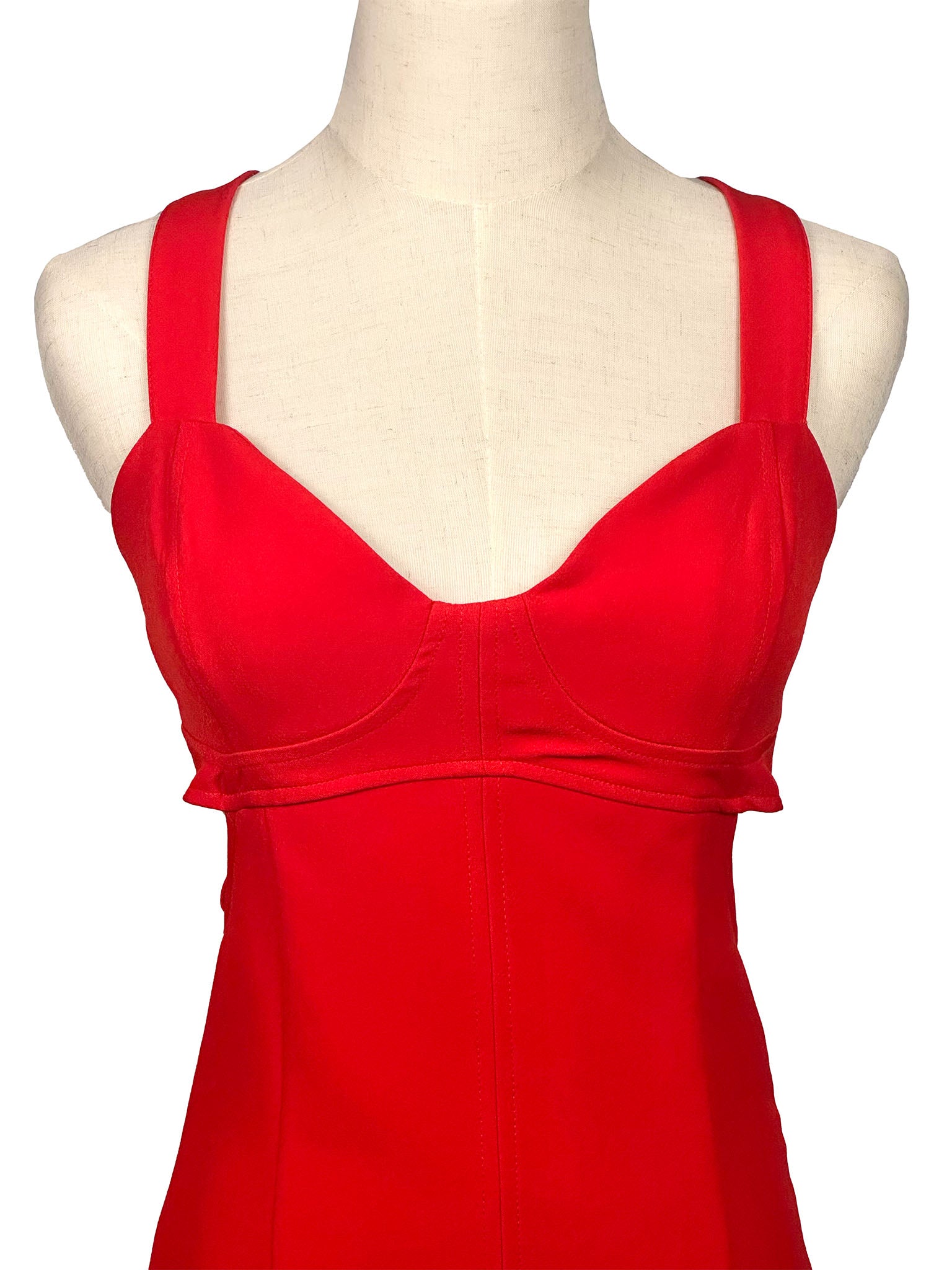 Red dress on a mannequin against a white background