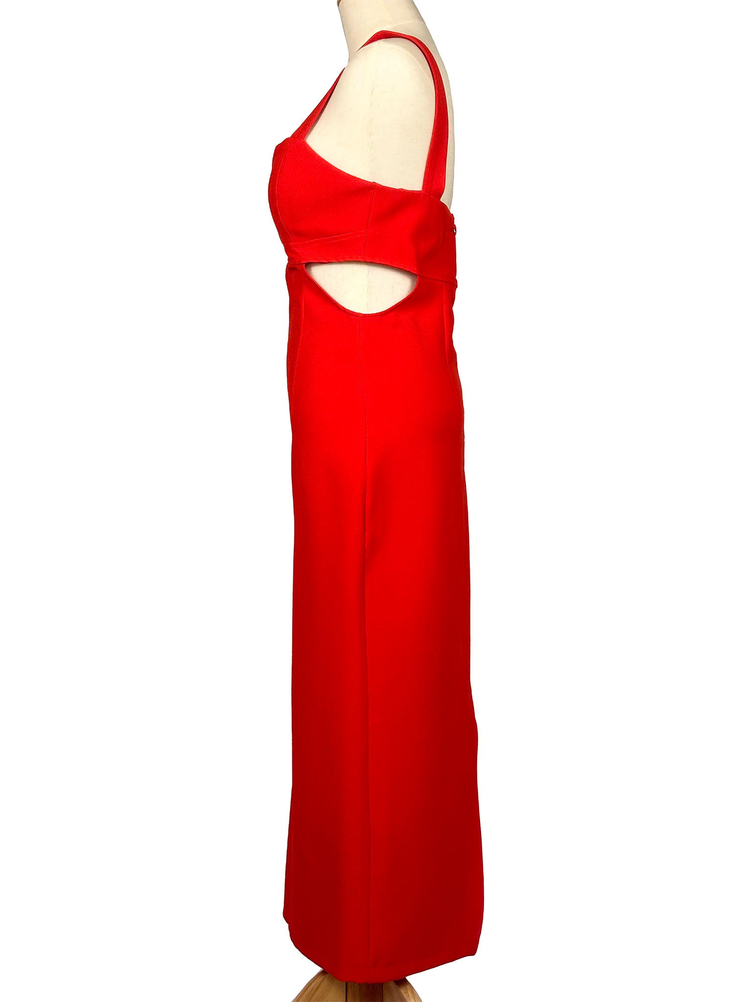 Red evening gown on a mannequin against a white background