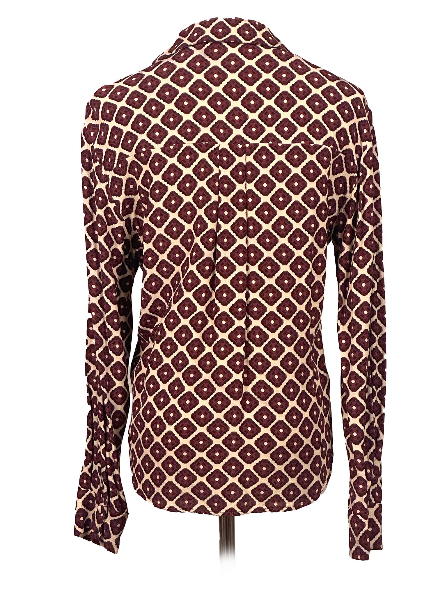 Patterned shirt on a mannequin against a white background