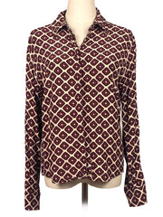 Patterned shirt on a mannequin against a white background