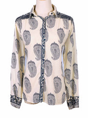 White shirt with dark blue paisley pattern on a mannequin against a white background