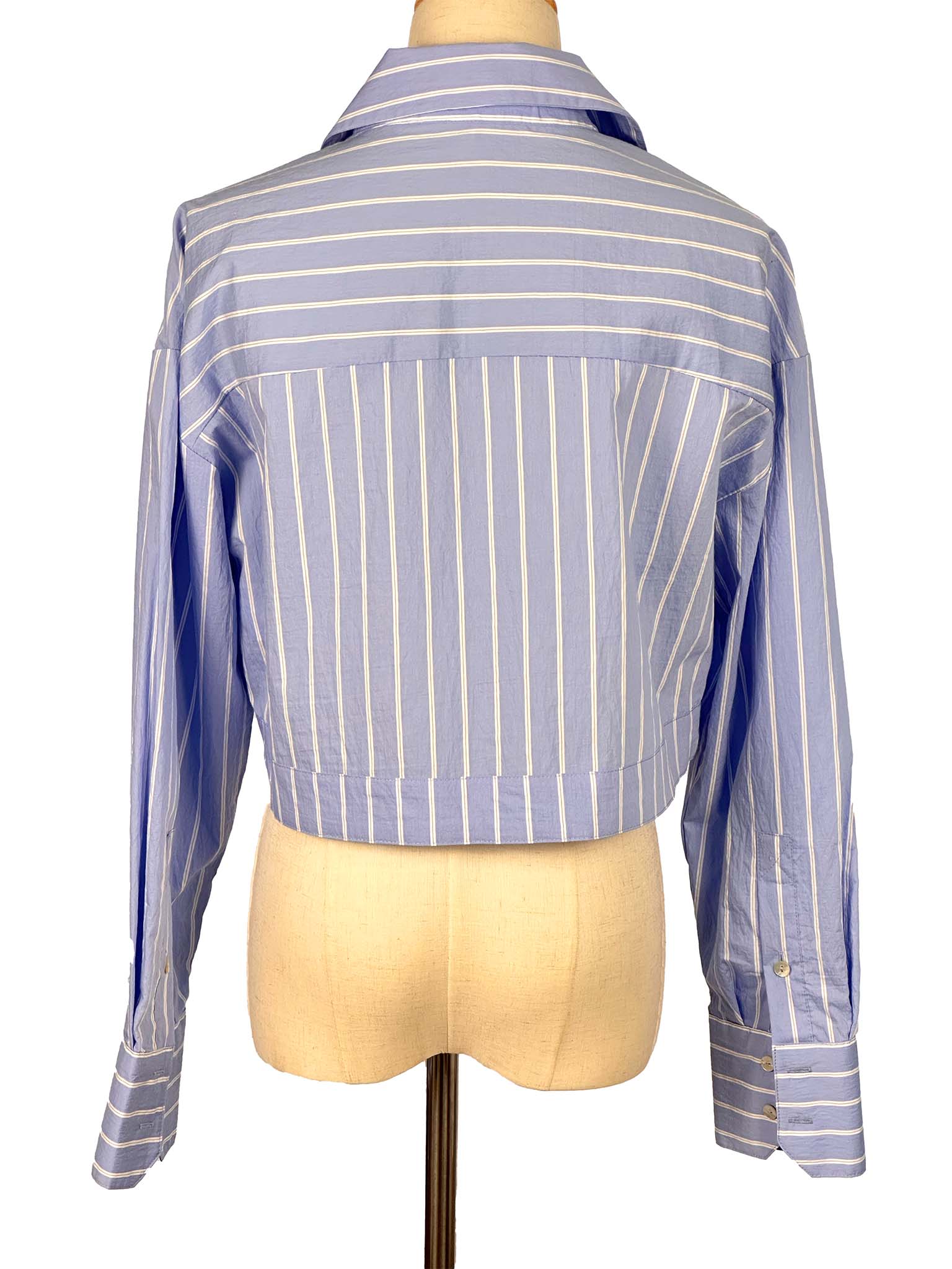 Blue and white striped shirt on a mannequin against a white background