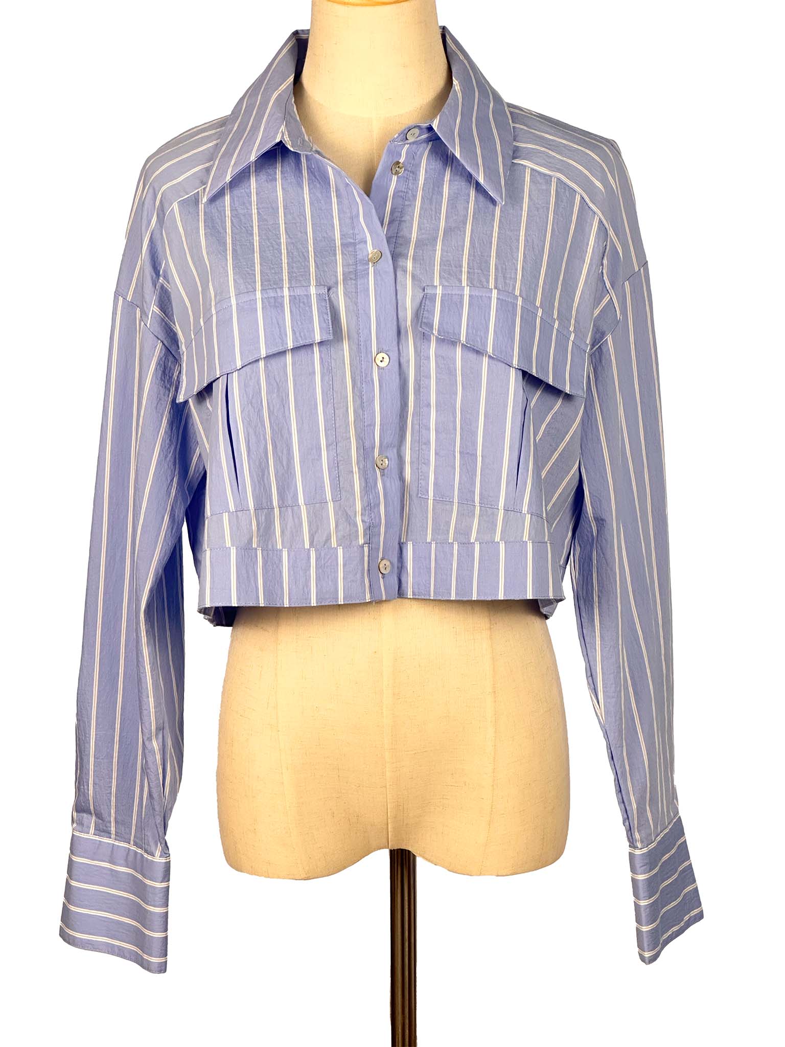 Blue and white striped shirt on a mannequin against a white background