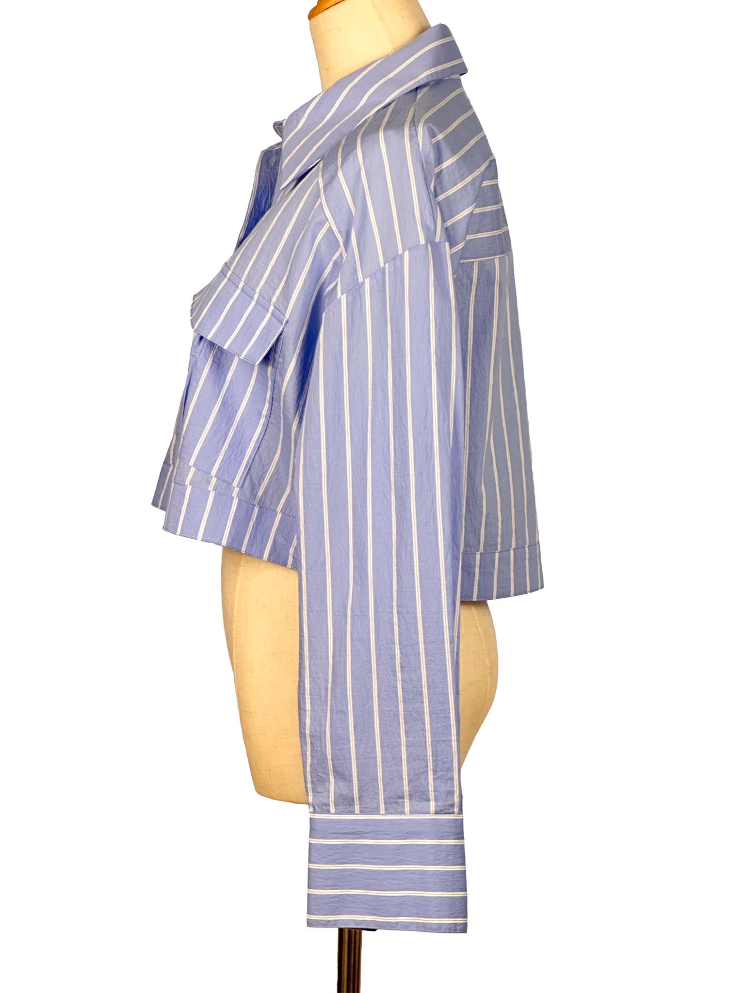 Blue and white striped shirt on a mannequin against a white background