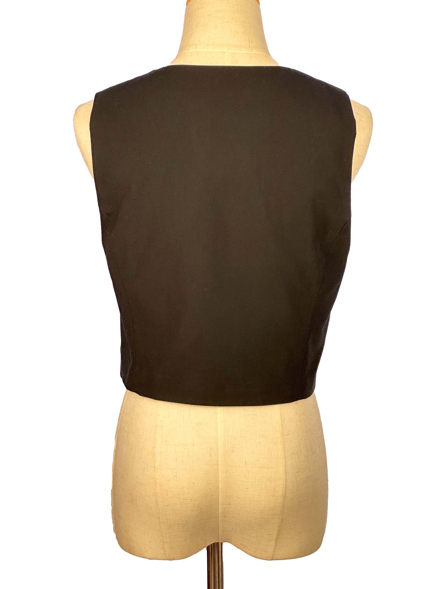 Brown sleeveless top on a mannequin against a white background