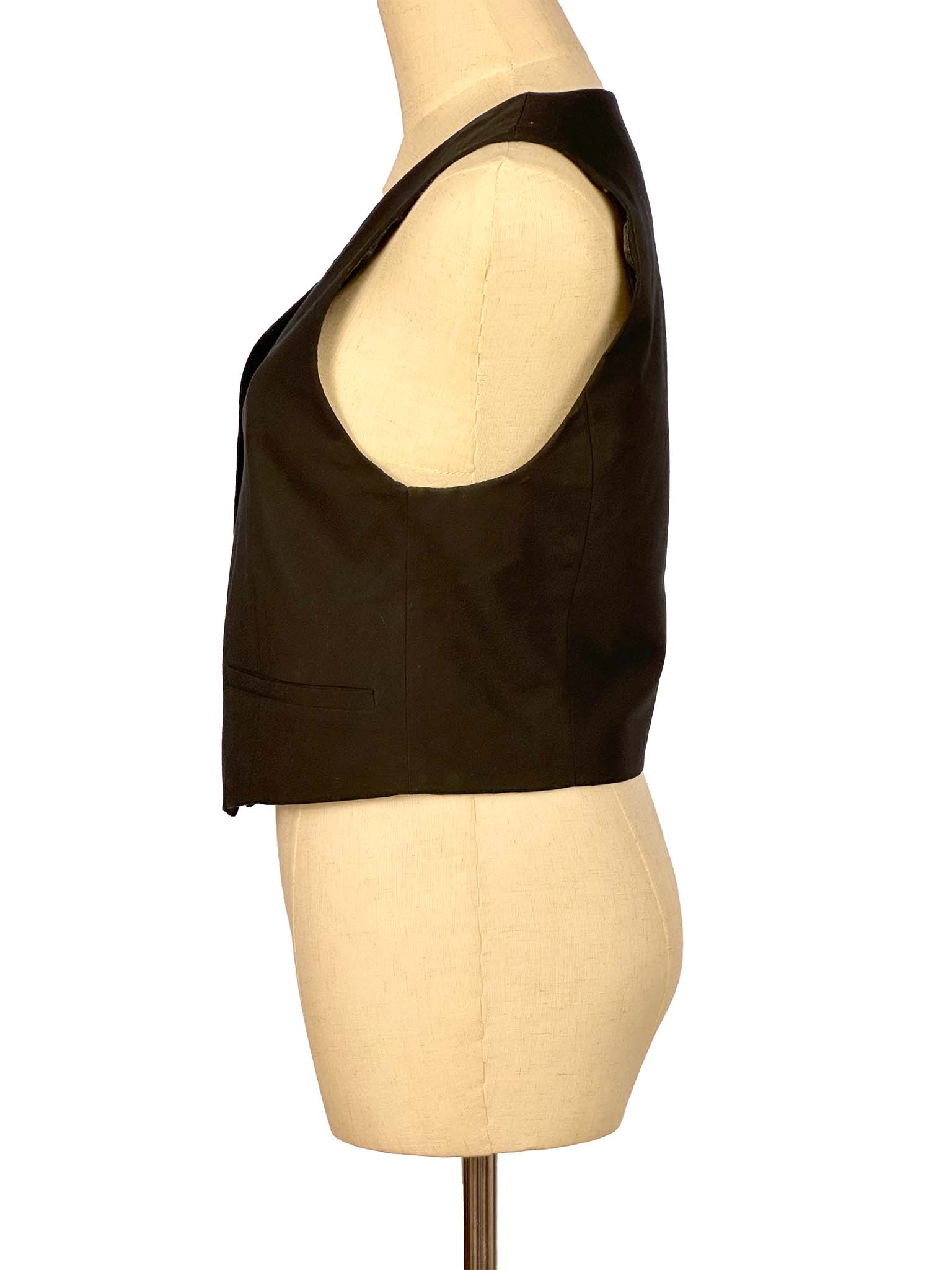 Black vest on a mannequin with a white background