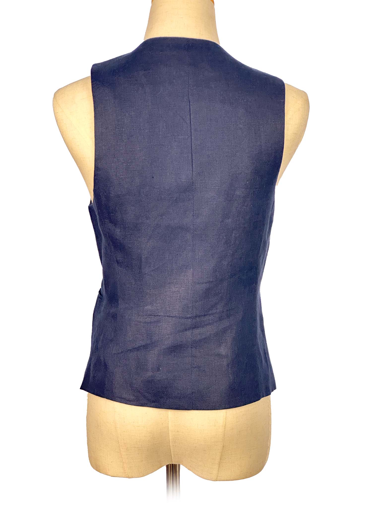 Blue vest on a mannequin against a white background