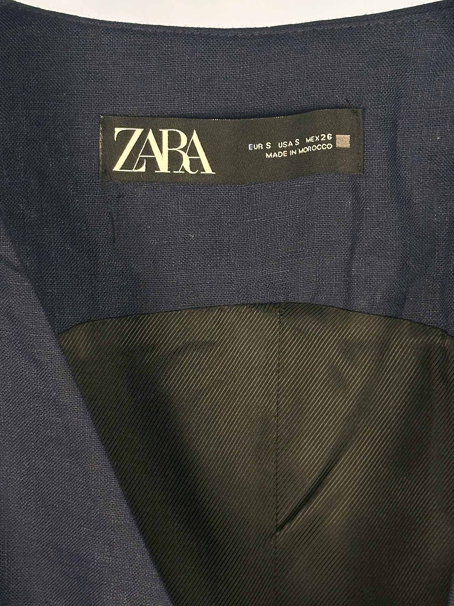 Zara label on a dark fabric background