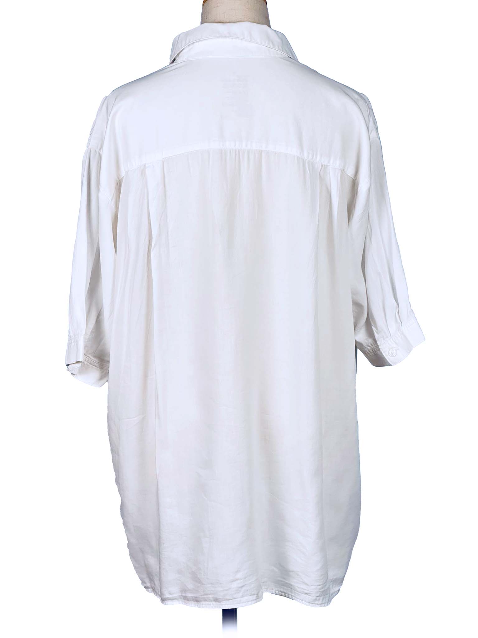 White shirt on a mannequin against a white background