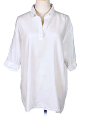White shirt on a mannequin against a white background