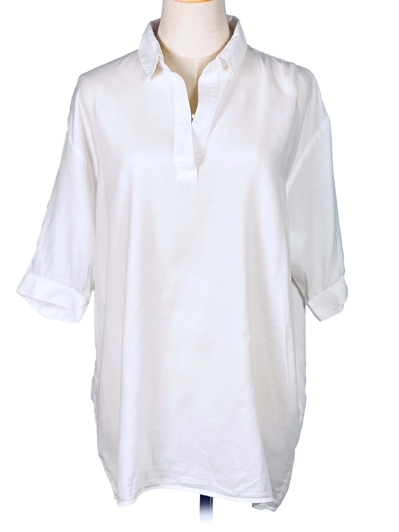 White shirt on a mannequin against a white background