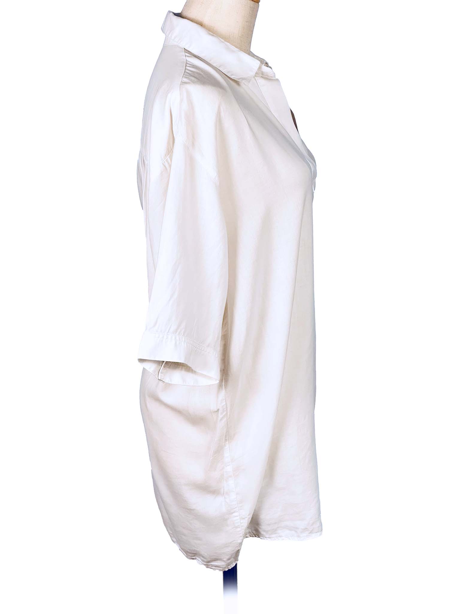 White shirt with a high collar on a mannequin against a white background