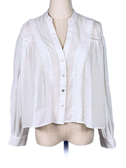 White blouse with lace details on a mannequin against a white background
