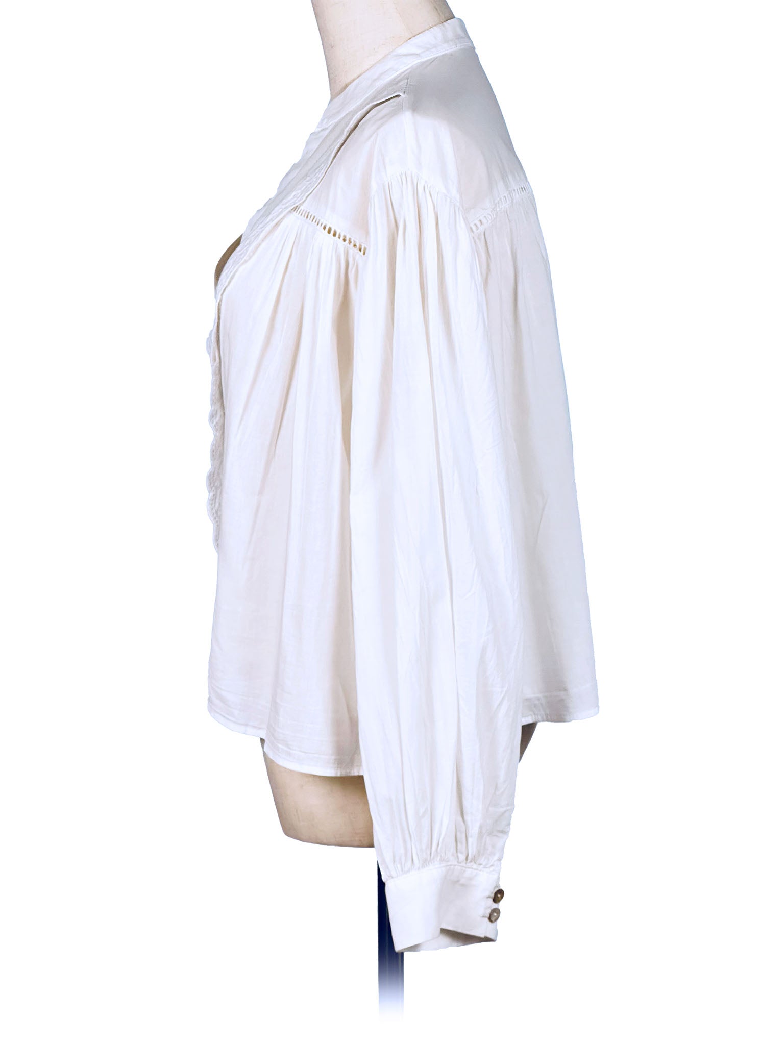 White blouse on a mannequin against a white background