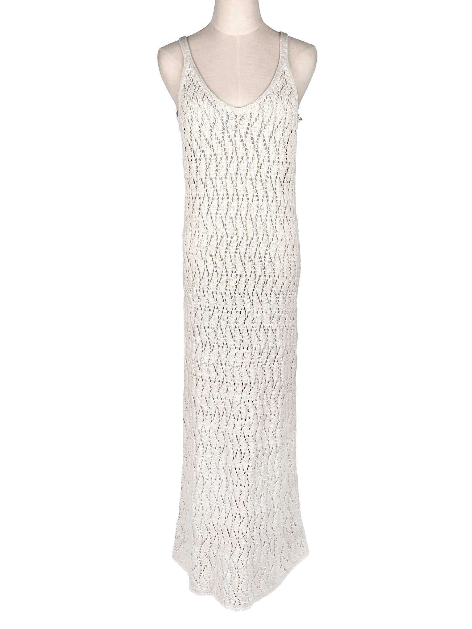 White crochet dress on a mannequin against a white background