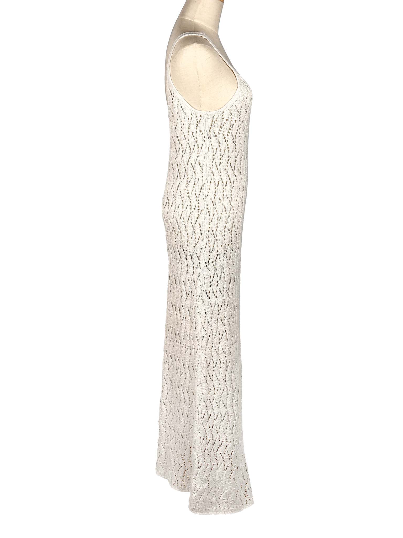 White textured dress on a mannequin against a white background