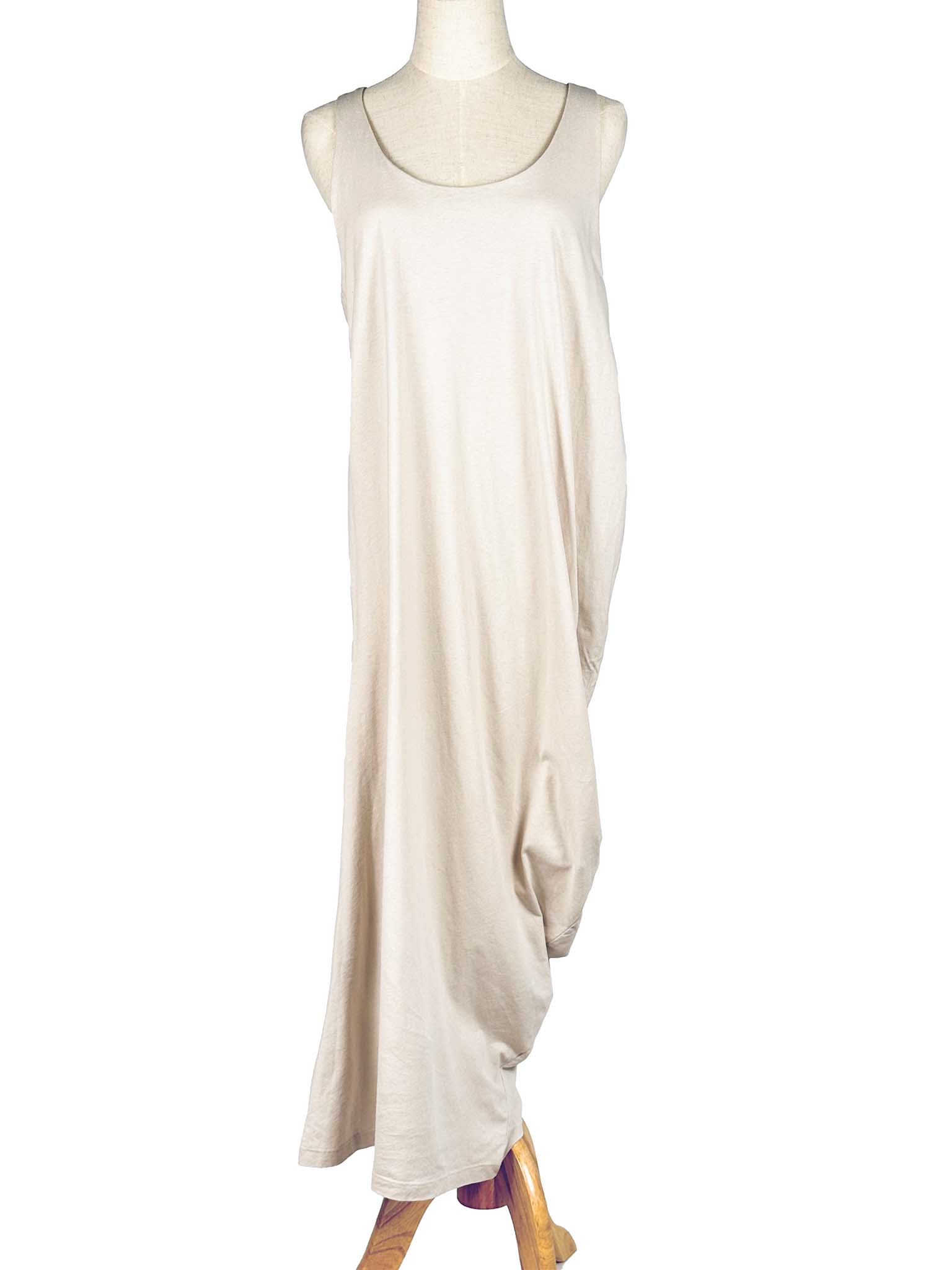 Beige sleeveless dress on a mannequin against a white background