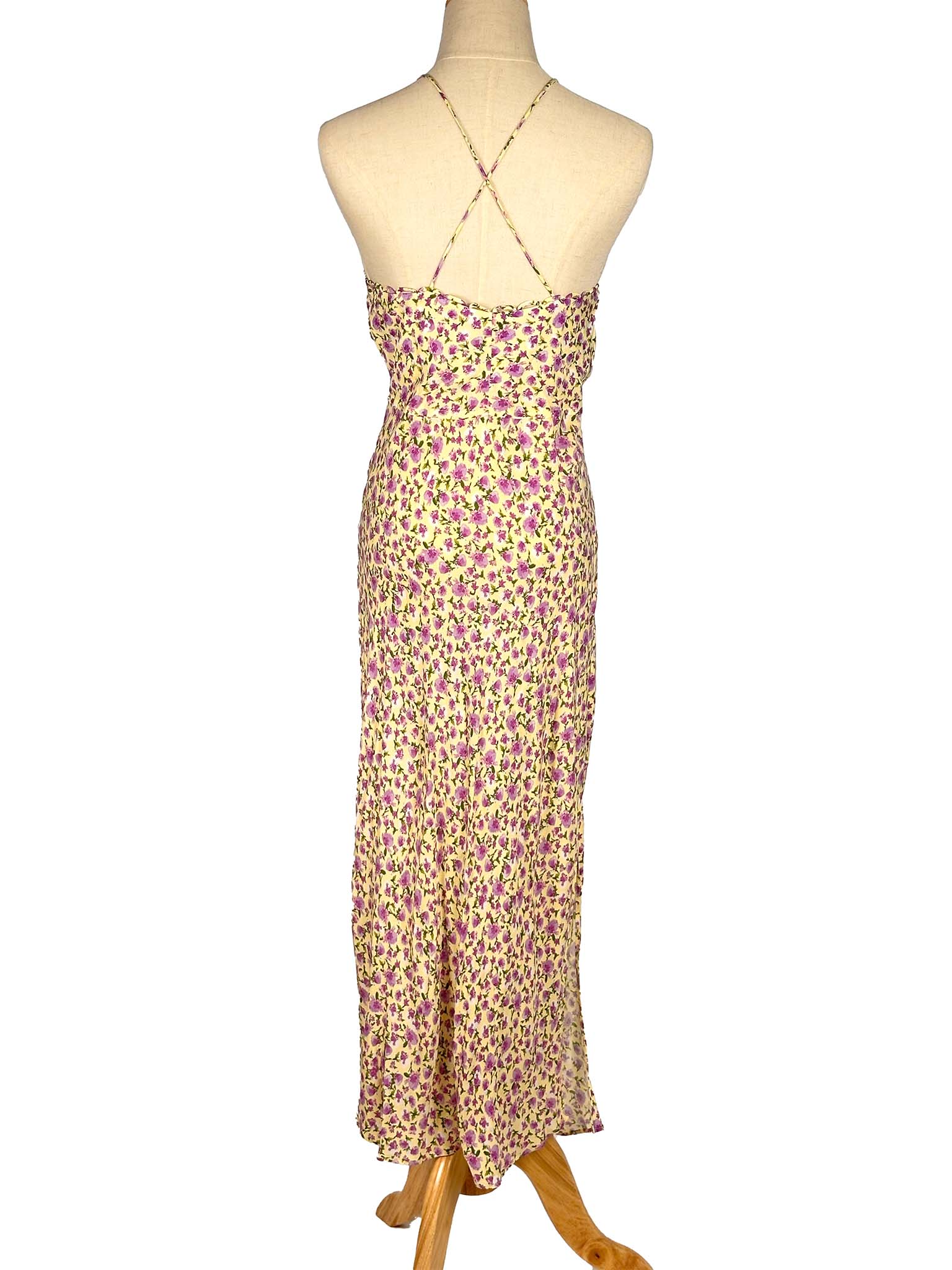 Floral dress on a mannequin against a white background