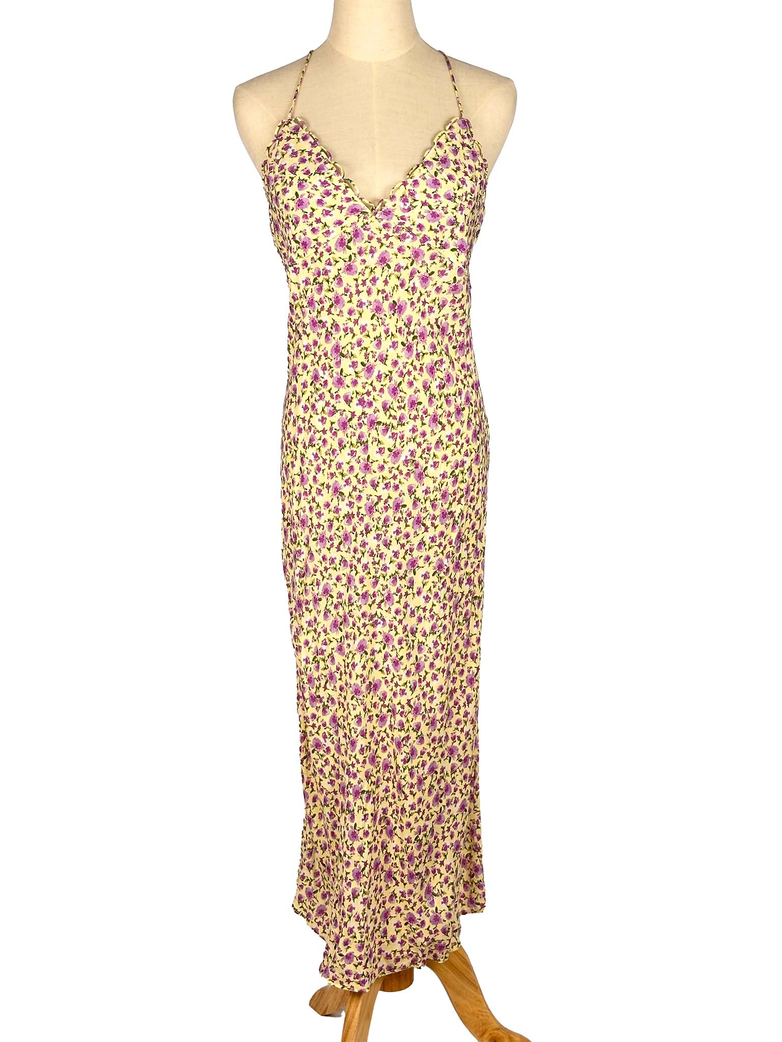 Floral dress on a mannequin against a white background