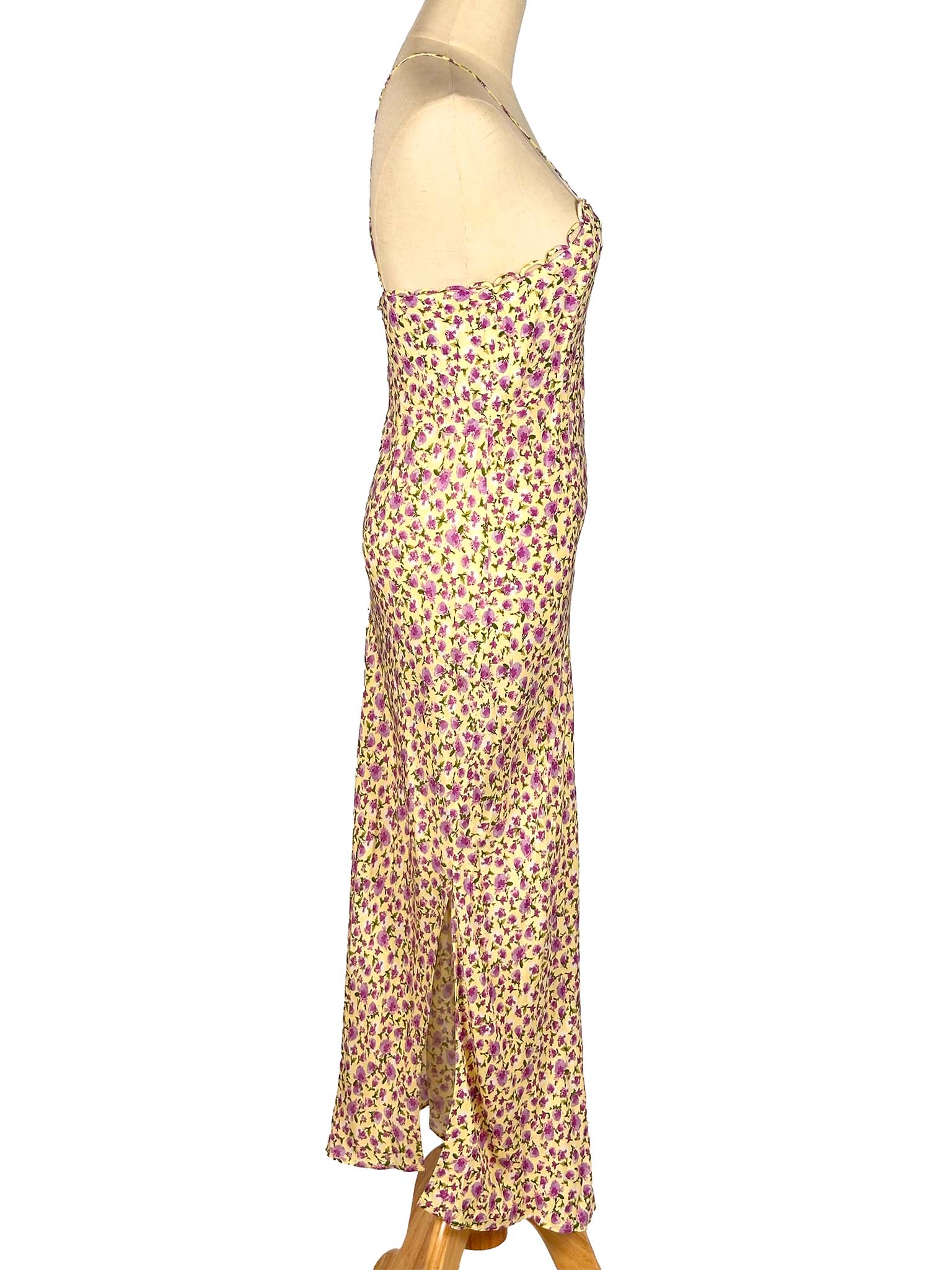 Floral strapless dress on a mannequin against a white background