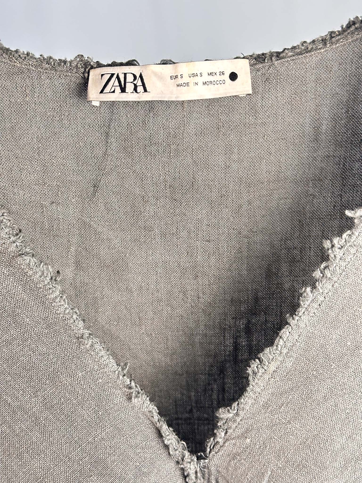 Zara label on a garment with a cut-out design