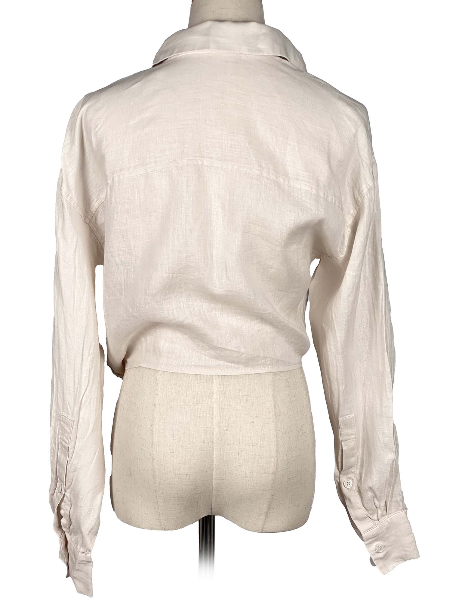 Zara vanilla shirt with a tie waist on a mannequin against a white background