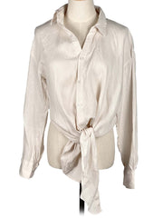 Zara vanilla shirt with a tie waist on a mannequin against a white background