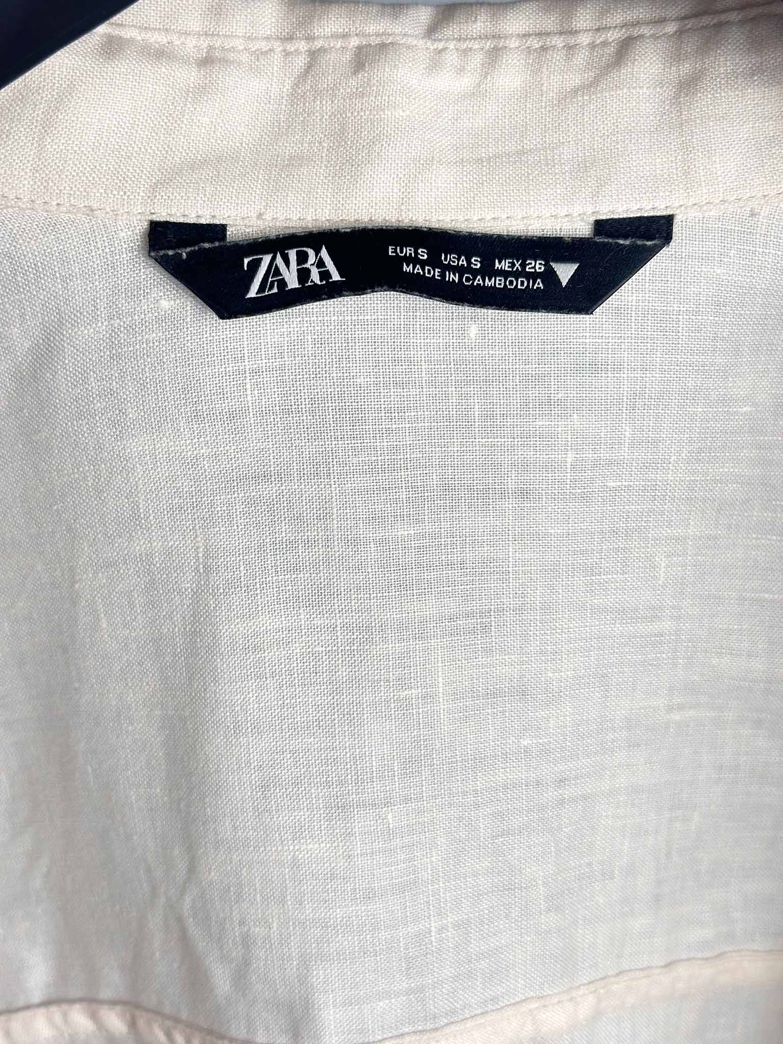 Zara label on a light-colored fabric background