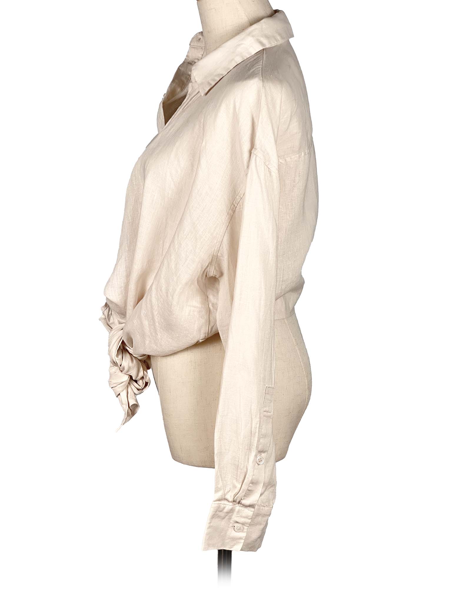 Zara vanilla shirt with a tie waist on a mannequin against a white background