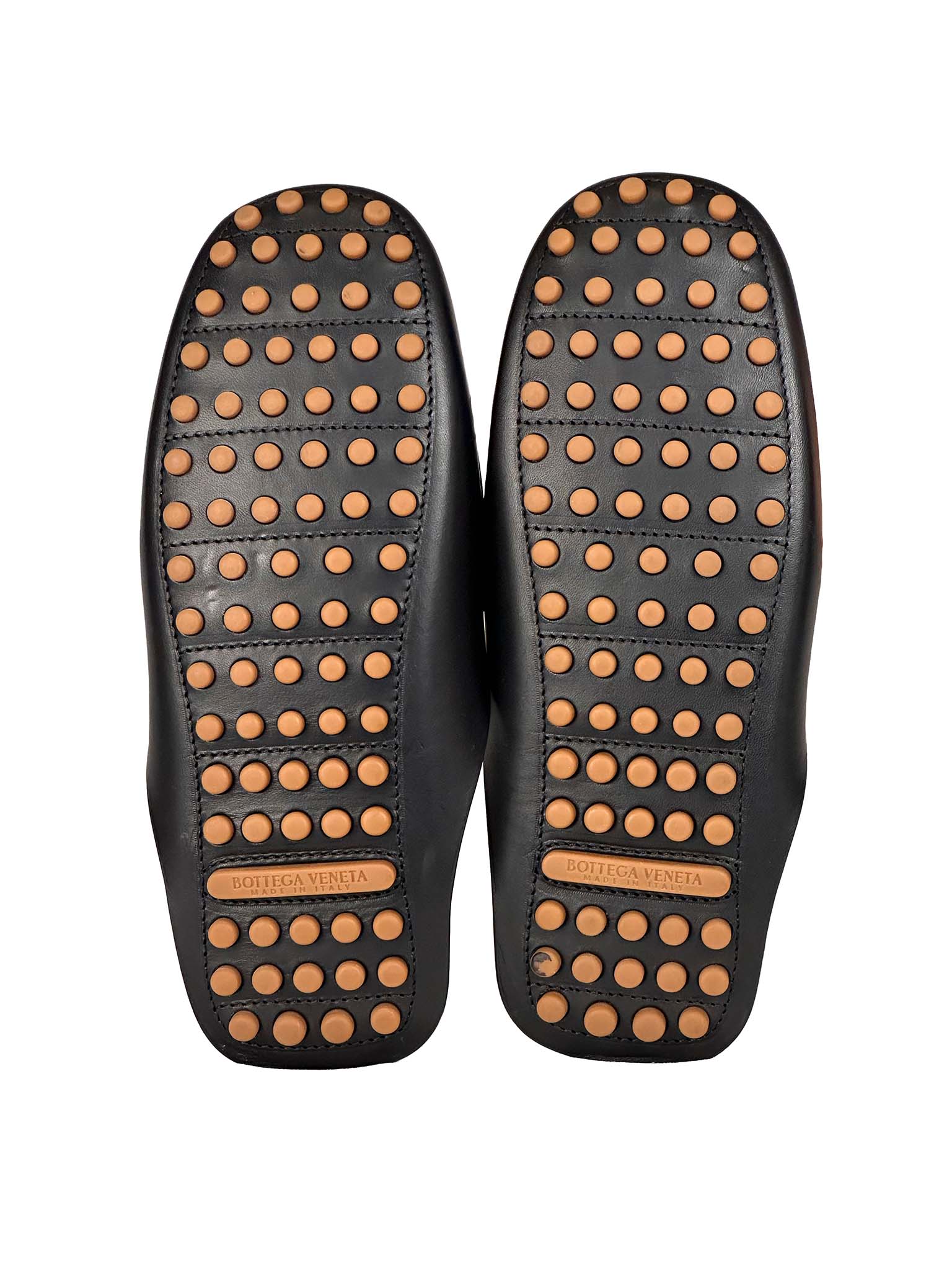 Bottega Veneta black insoles with brown dots on a white background