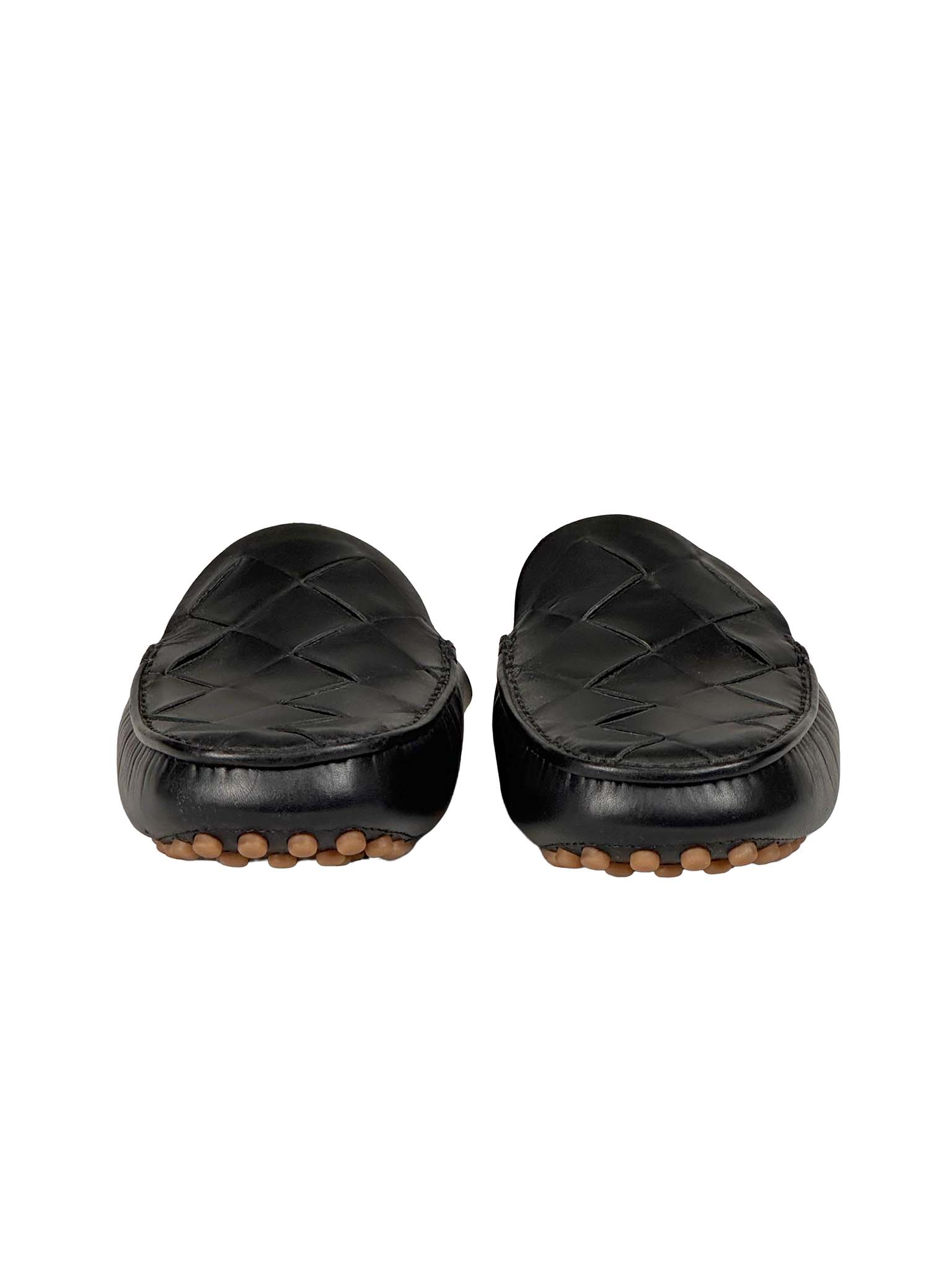 Pair of Bottega Veneta black quilted loafers on a white background