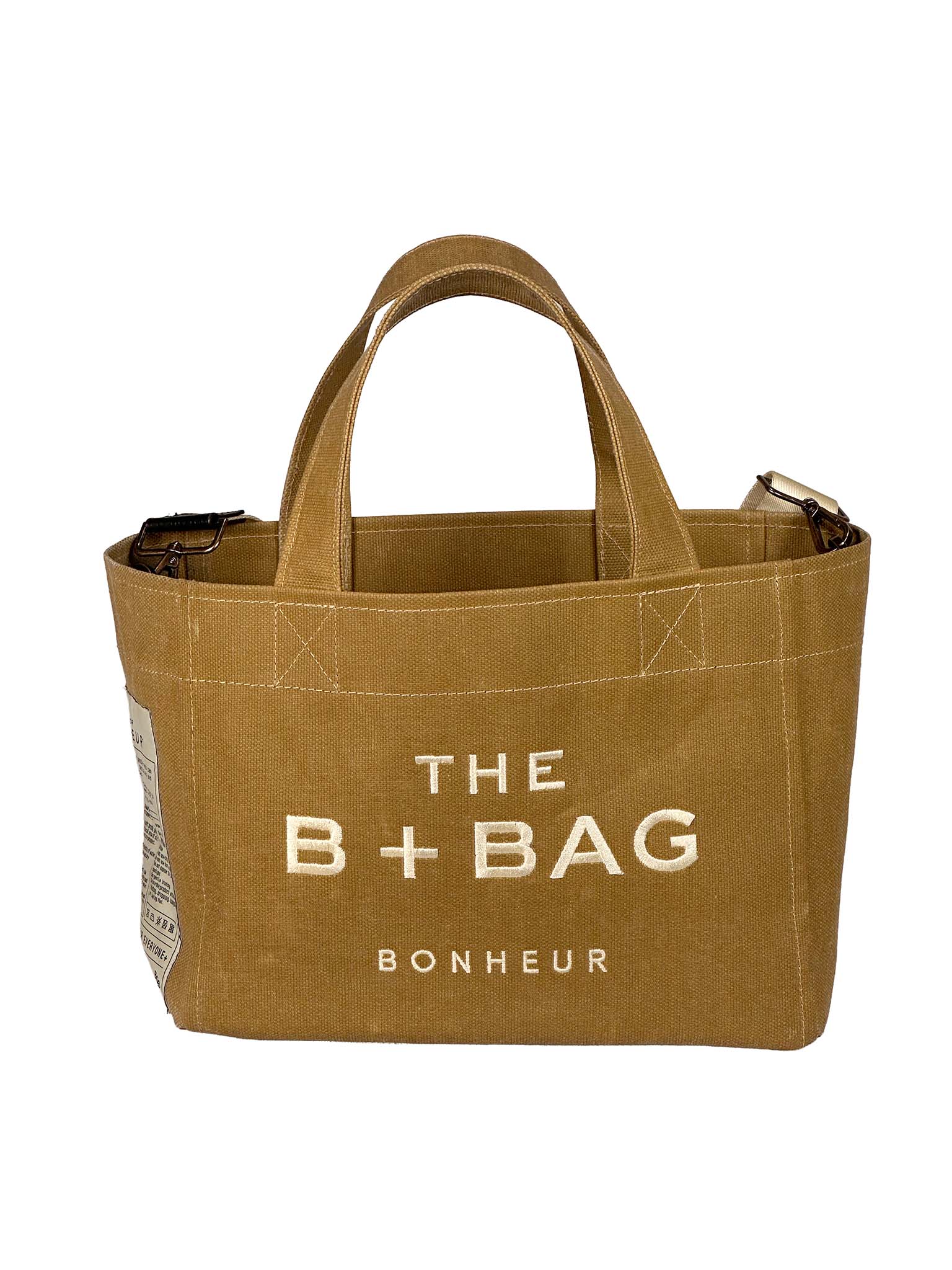 Bonheur brown tote bag with 'The B+ Bag Bonheur' text on a white background
