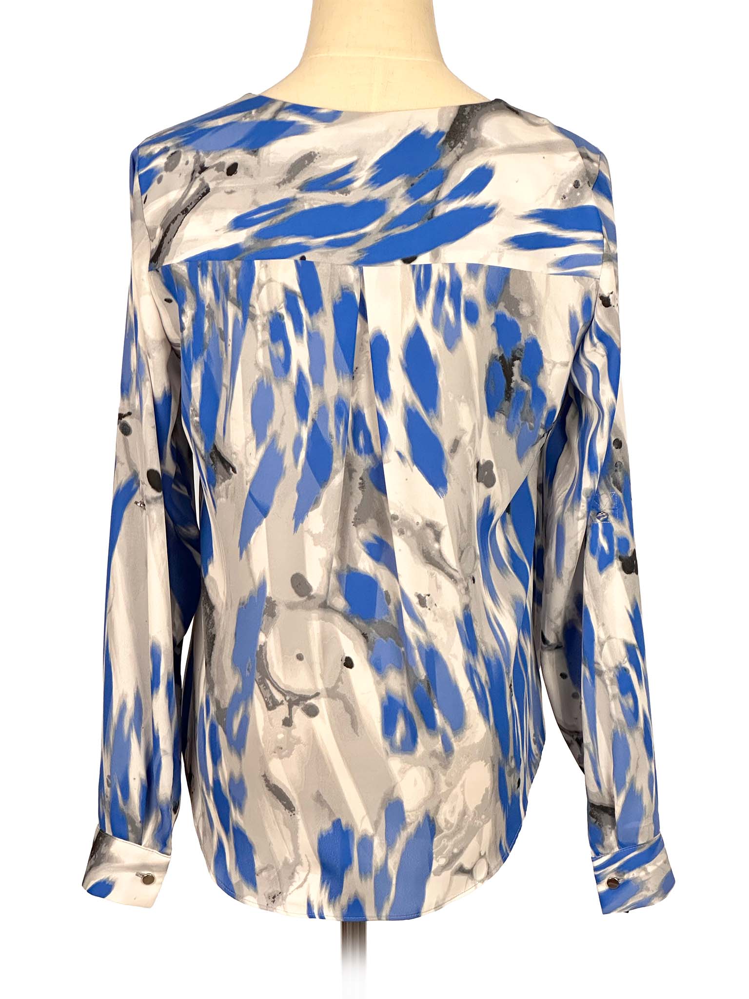 Blue and gray patterned Alfani blouse on a mannequin against a white background