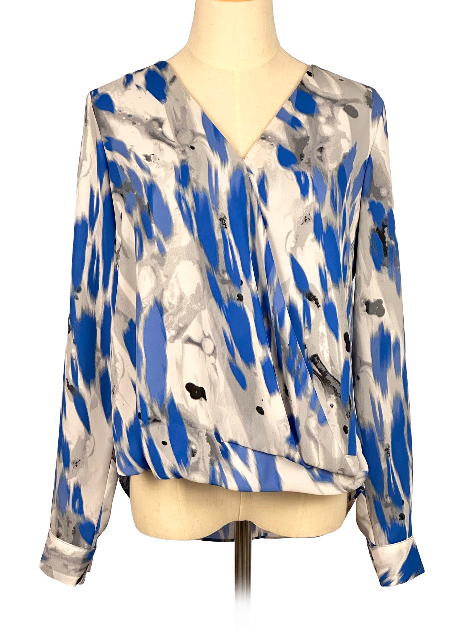 Blue and gray patterned Alfani blouse on a mannequin against a white background