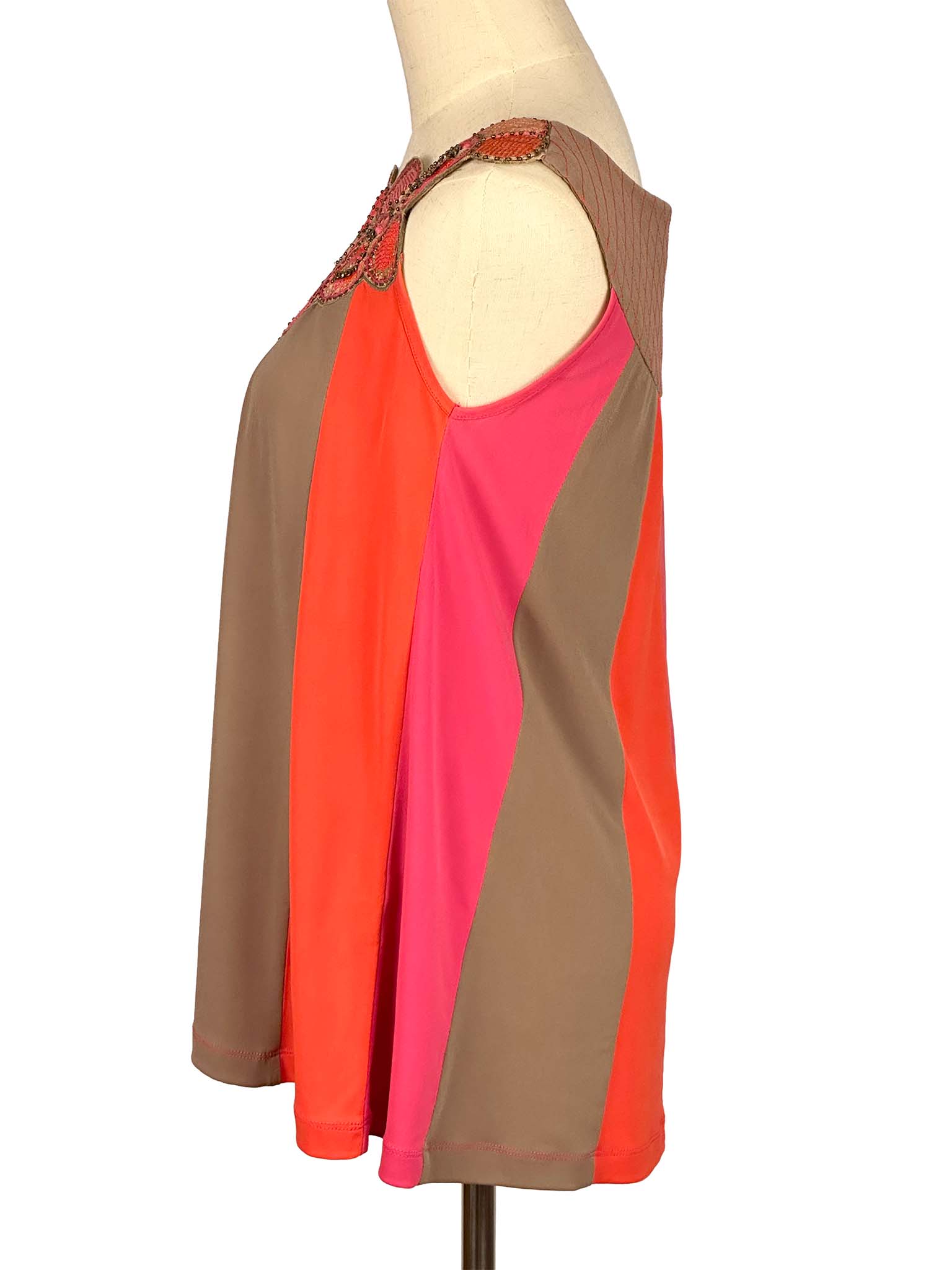 Ranna Gill sleeveles top with brown, orange, and pink sections on a mannequin against a white background