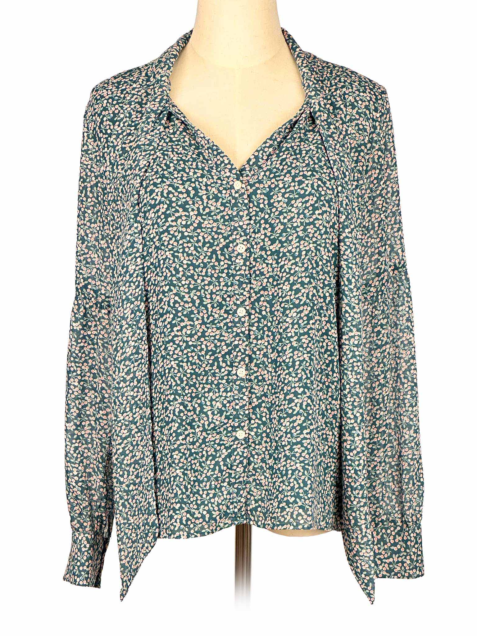 Floral-patterned green Loft blouse on a mannequin against a white background