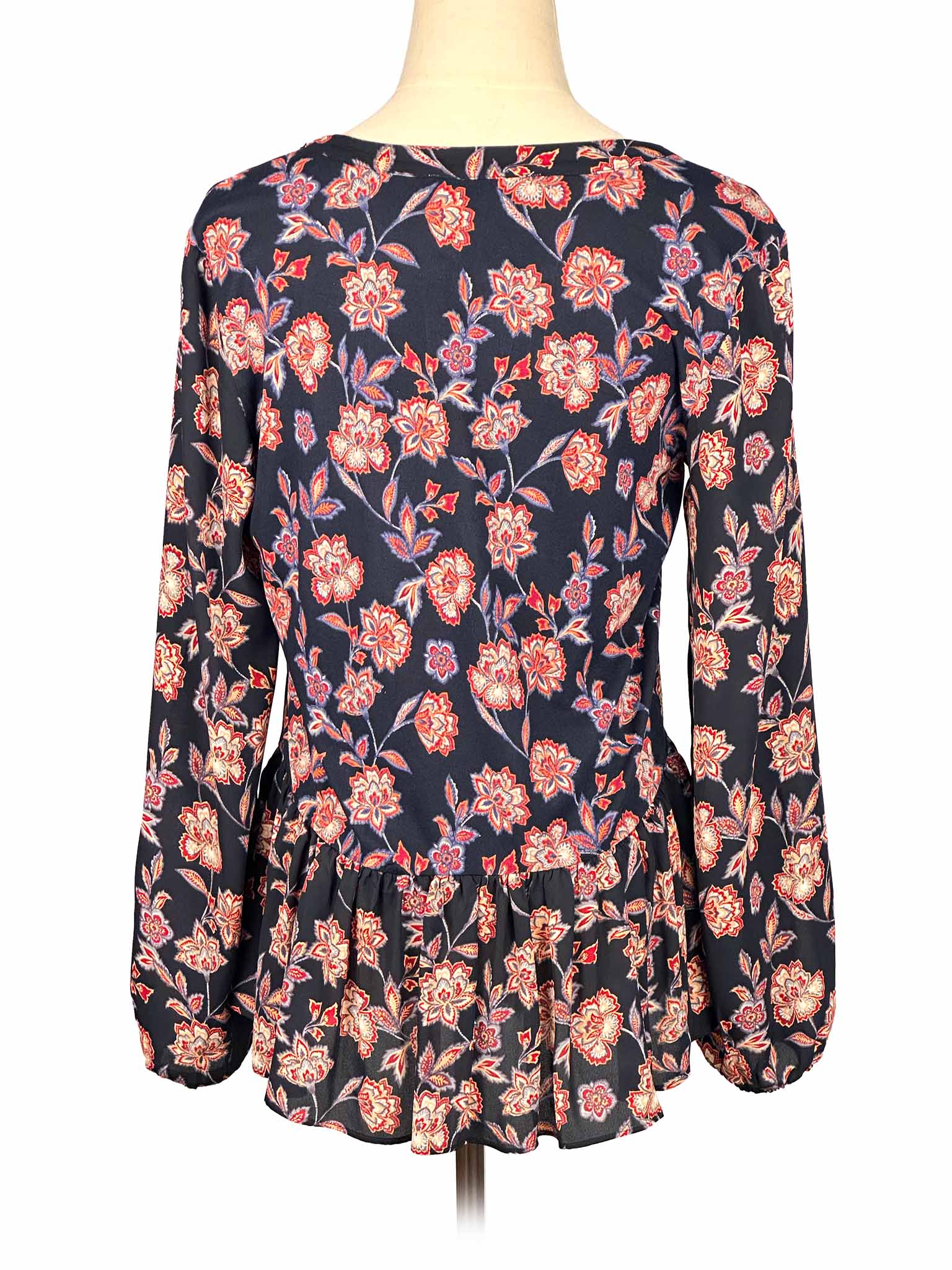 Floral Loft blouse on a mannequin against a white background