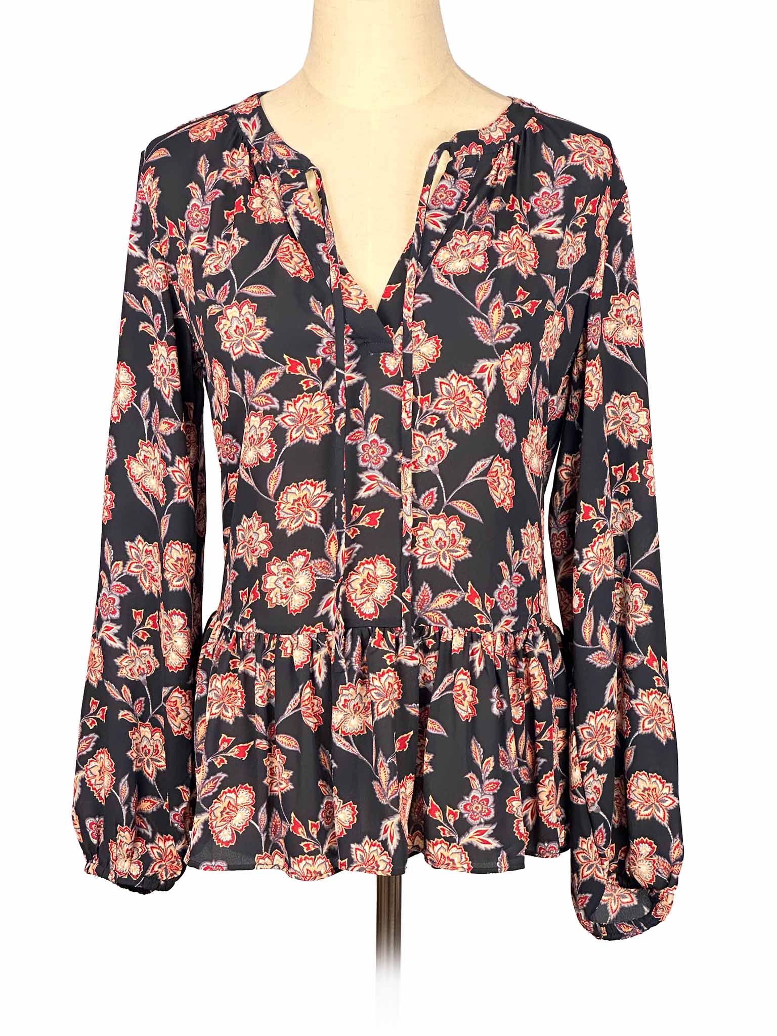 Floral Loft blouse on a mannequin against a white background