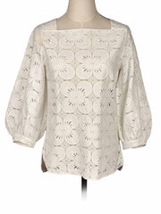 Beige Massimo Dutti lace blouse on a mannequin against a white background