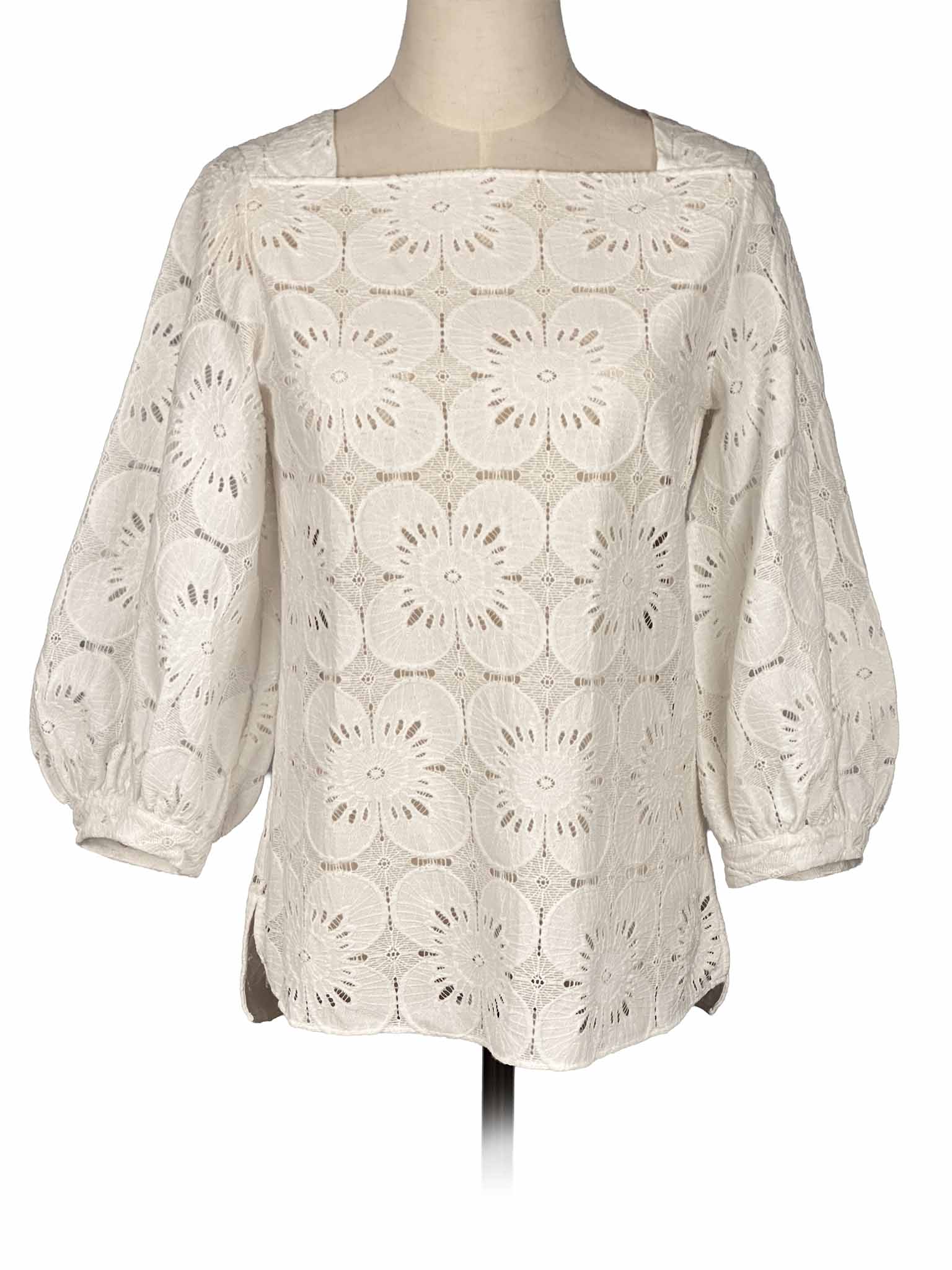 Beige Massimo Dutti lace blouse on a mannequin against a white background