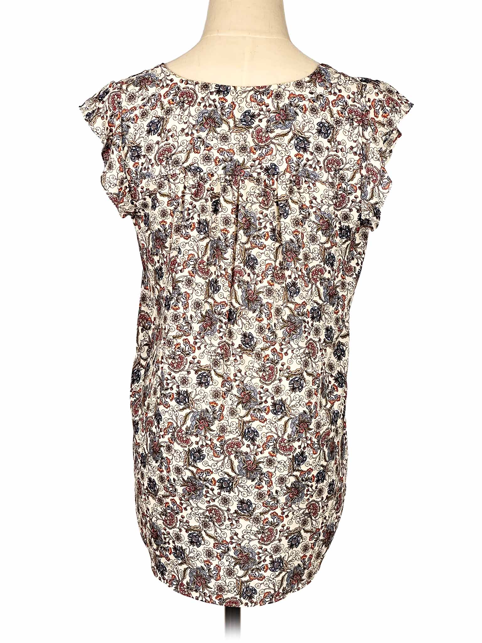 Floral-patterned sleeveless Loft top on a mannequin against a white background
