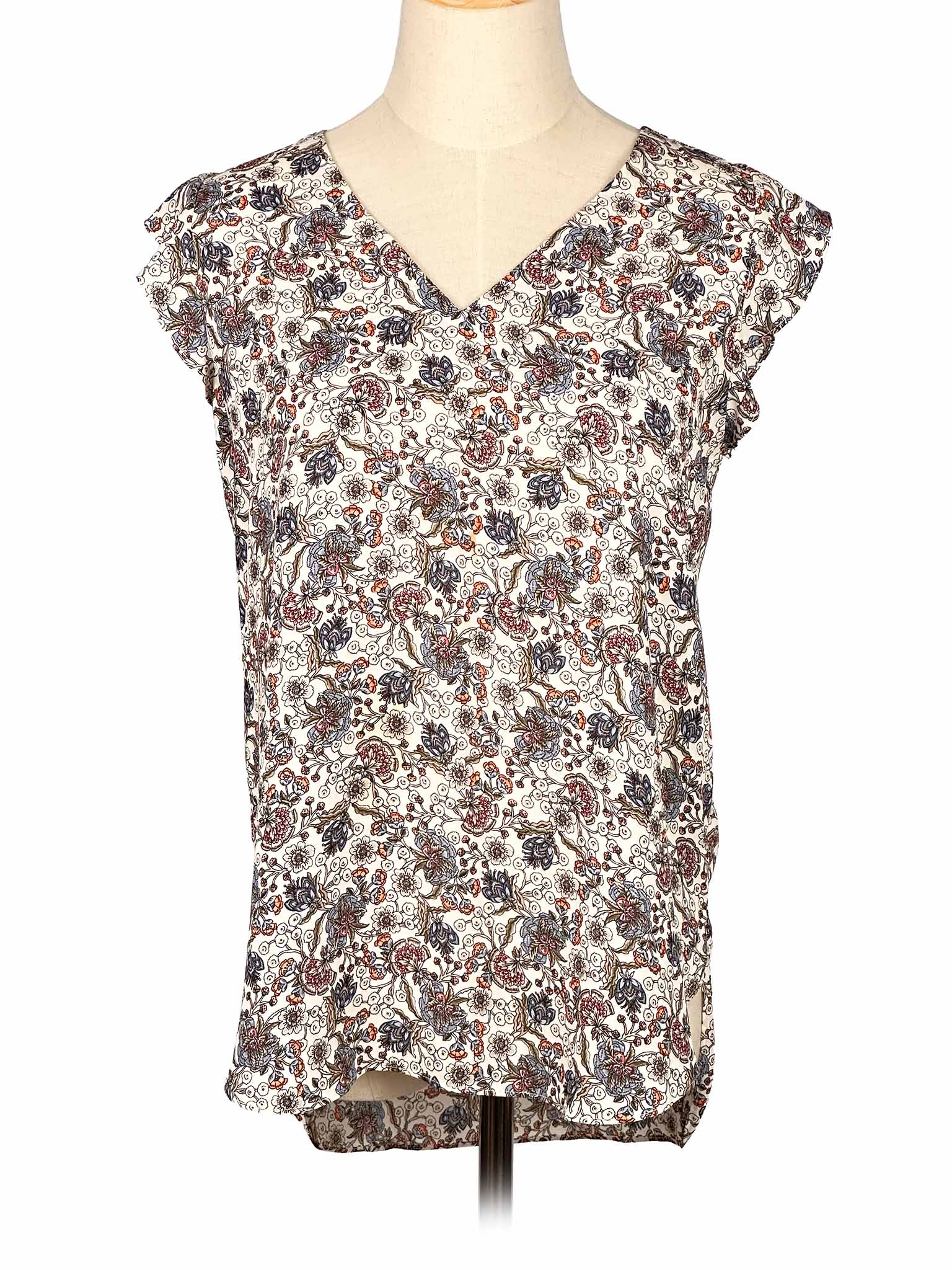 Floral-patterned sleeveless Loft top on a mannequin against a white background