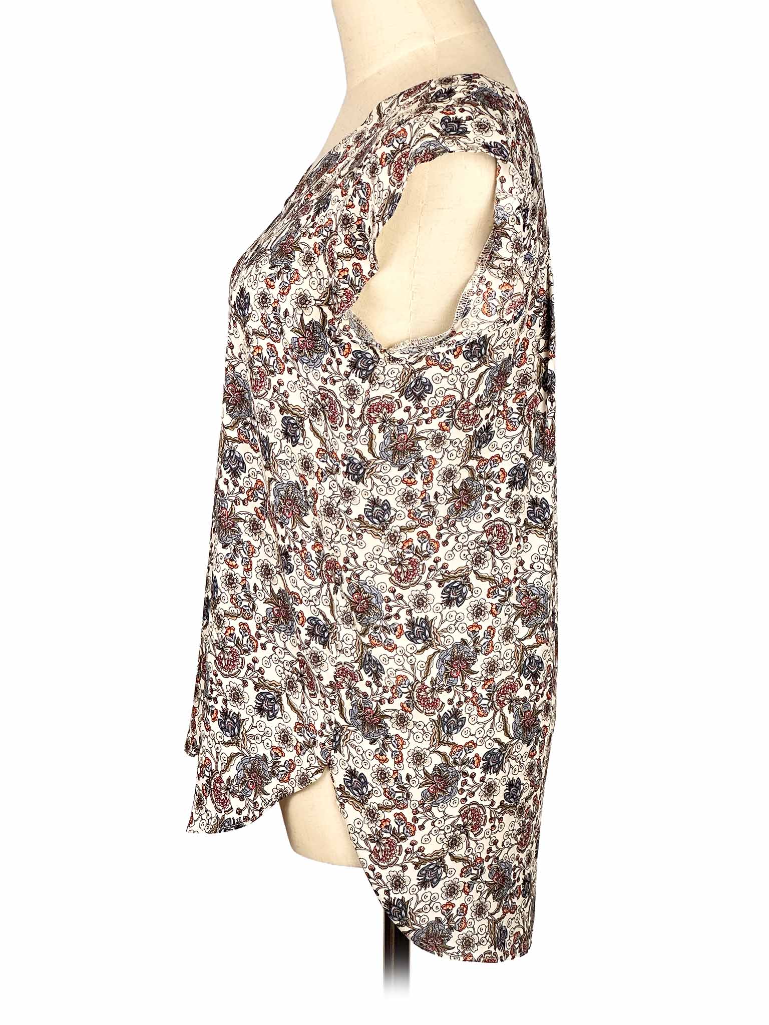 Floral-patterned sleeveless Loft top on a mannequin against a white background