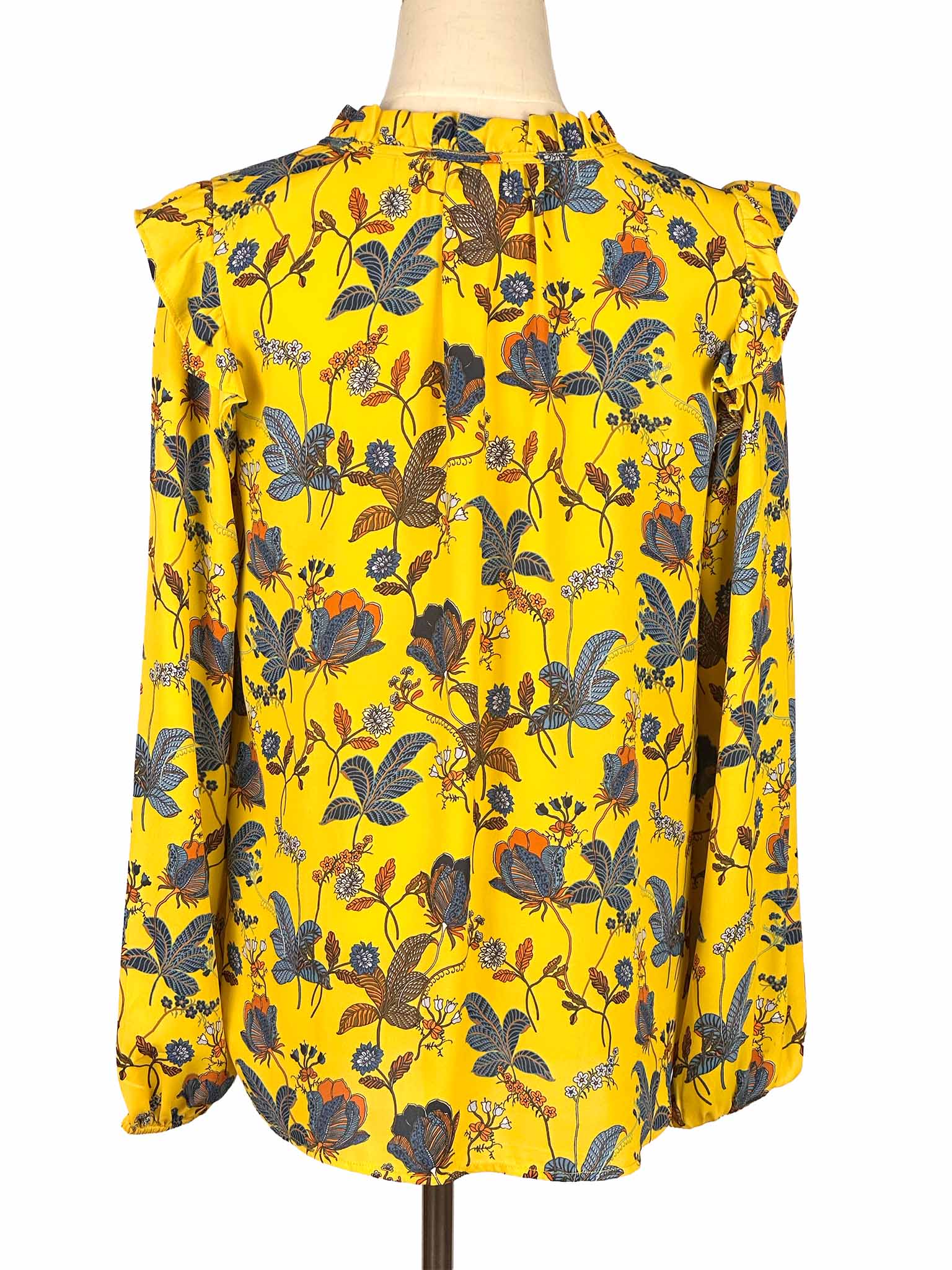 Yellow floral Loft blouse on a mannequin against a white background