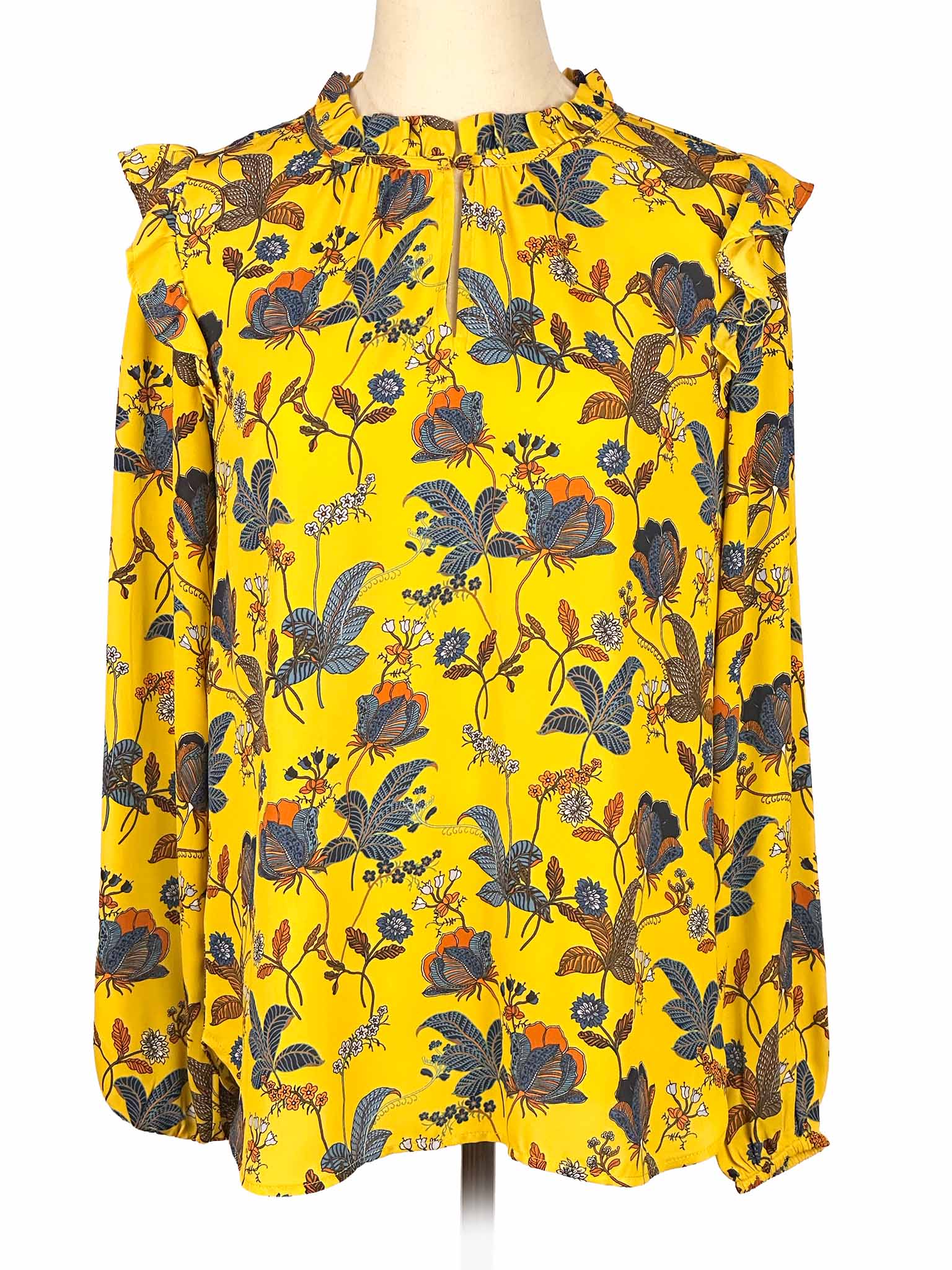 Yellow floral Loft blouse on a mannequin against a white background