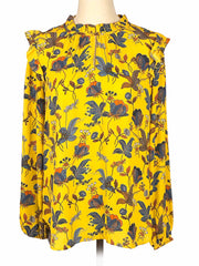 Yellow floral Loft blouse on a mannequin against a white background