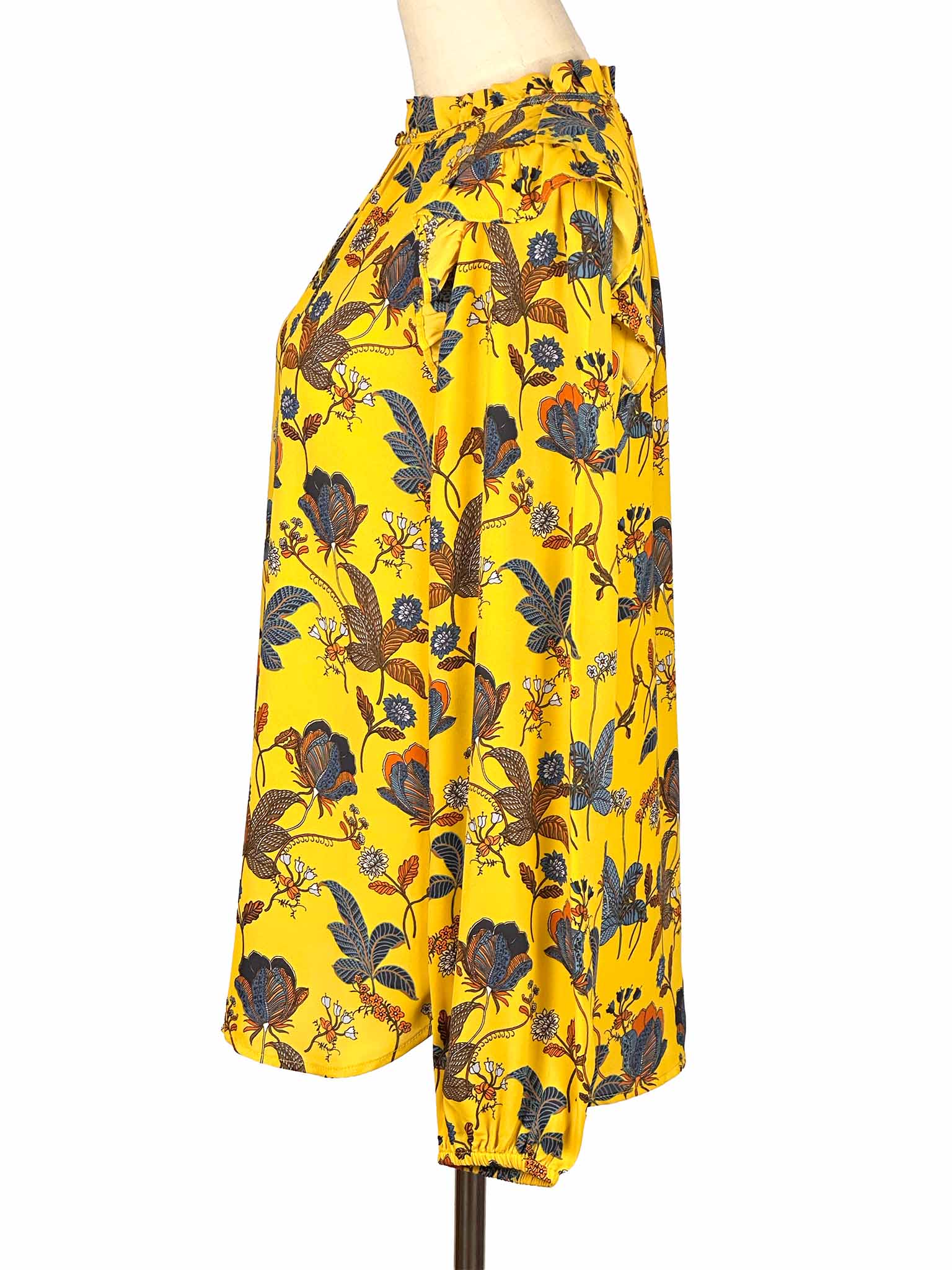 Yellow floral Loft blouse on a mannequin against a white background