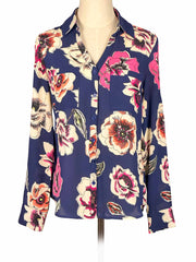 Floral Express blouse on a mannequin against a white background
